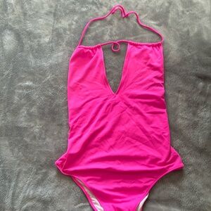 Pink one piece bathing suit tie back. In great condition.